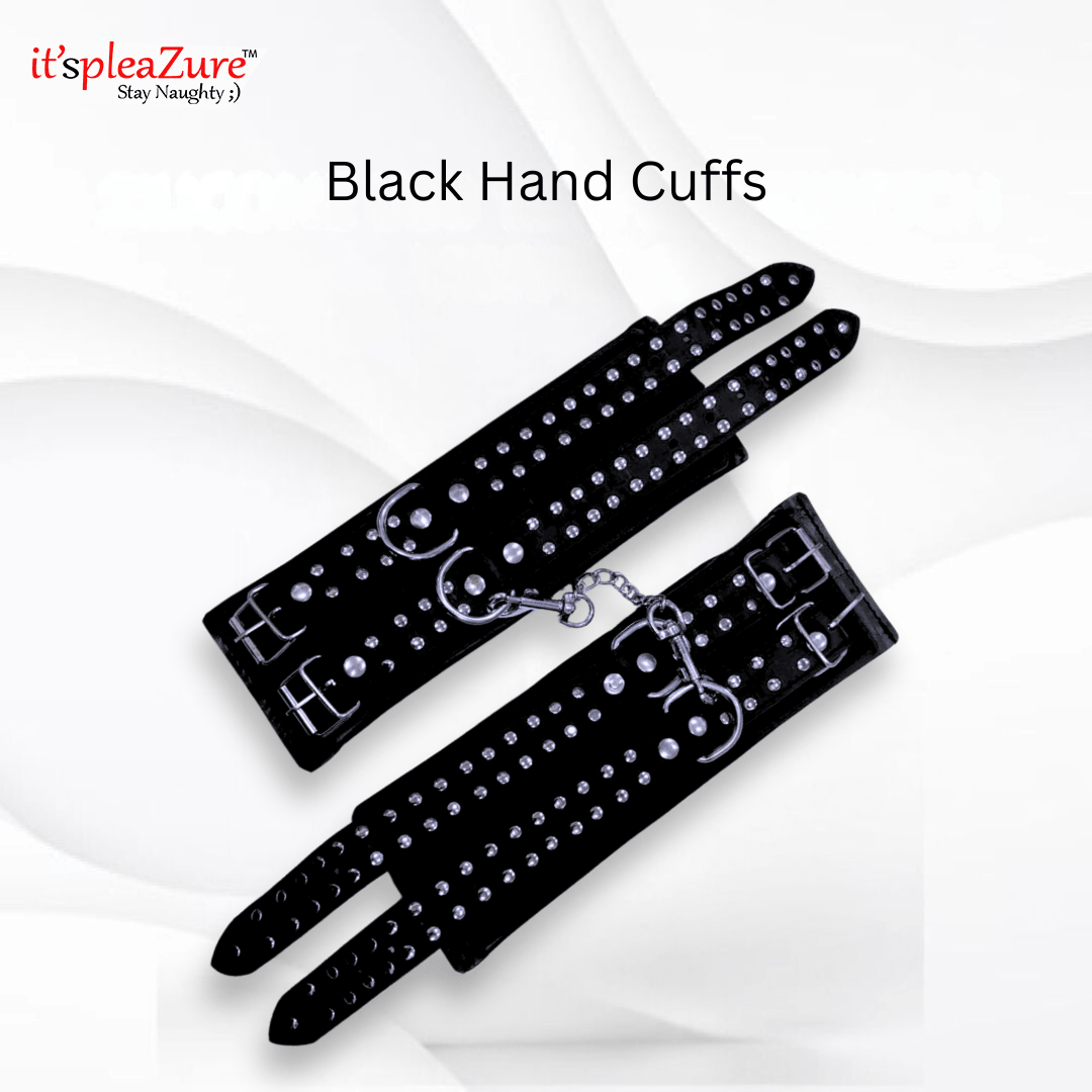 Black hand cuffs with studded details on a white background, featuring the brand 'it's pleazure'.