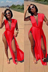 A model wearing a red polyester cutout dress with a deep V neck and side cutouts, paired with sunglasses and high-heeled sandals.