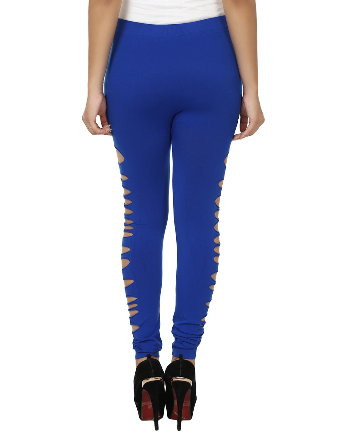 A person wearing dark blue shredded leggings and a white top, standing heel-to-toe in high heels.