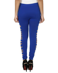 A person wearing dark blue shredded leggings and a white top, standing heel-to-toe in high heels.
