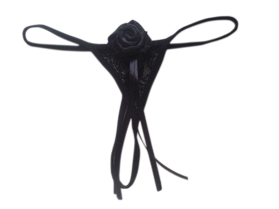 A black ribbon thong for women with a floral design on the front.