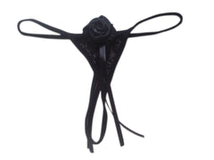 A black ribbon thong for women with a floral design on the front.