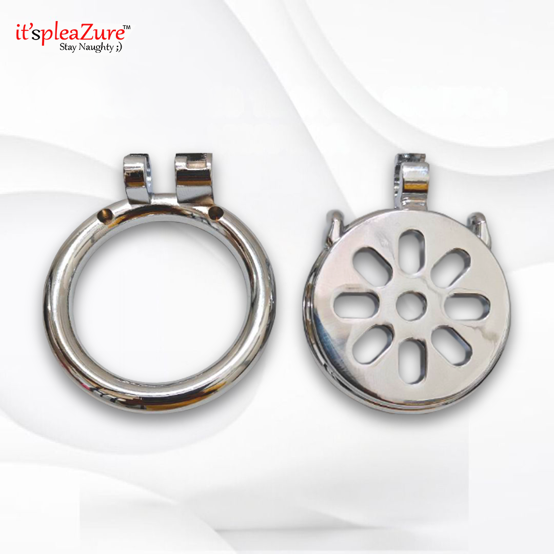 Two metallic objects, one circular and one with a floral design, on a white background.