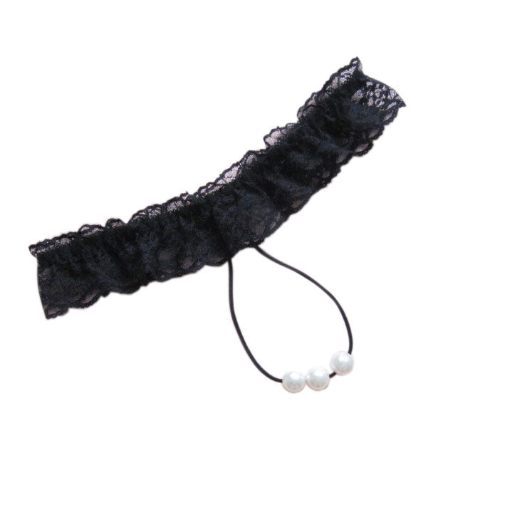 Black lace garter with pearls on a white background