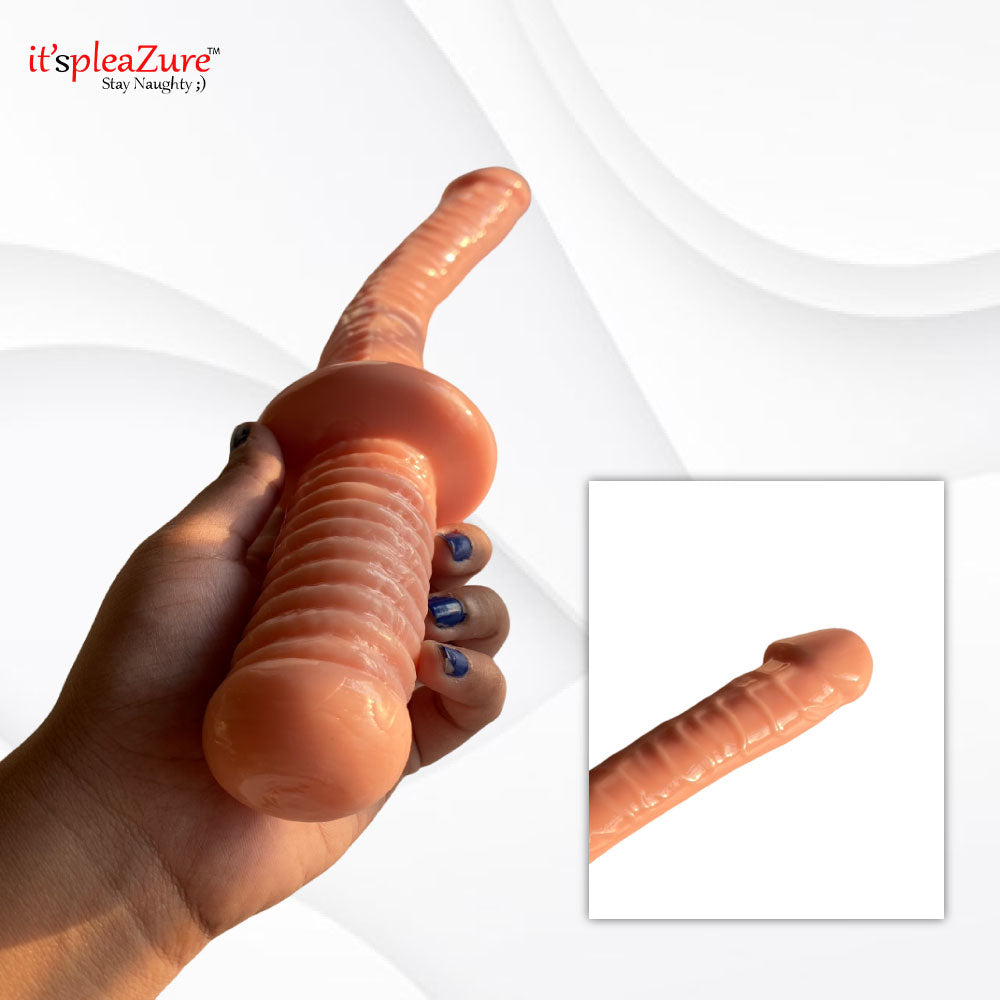 Hand holding 18-inch giant realistic dildo - size comparison